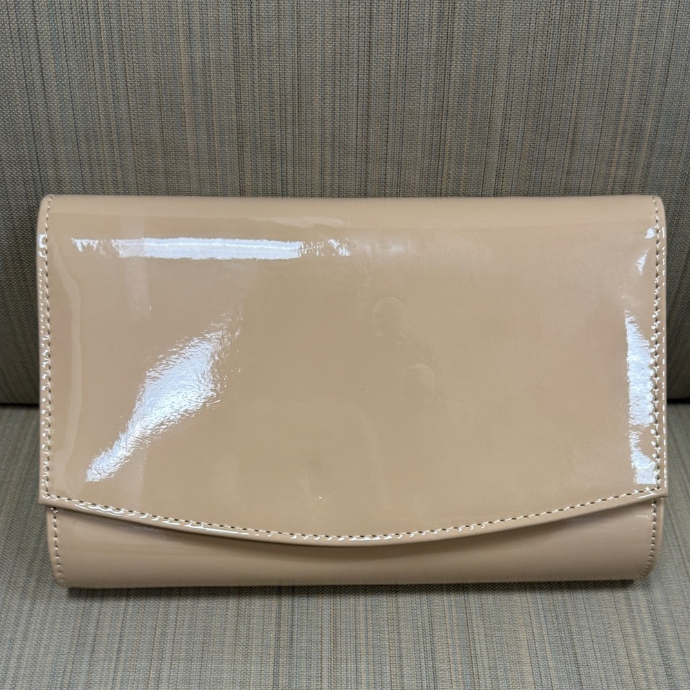 Elegant, shiny clutch purse with attached chain strap